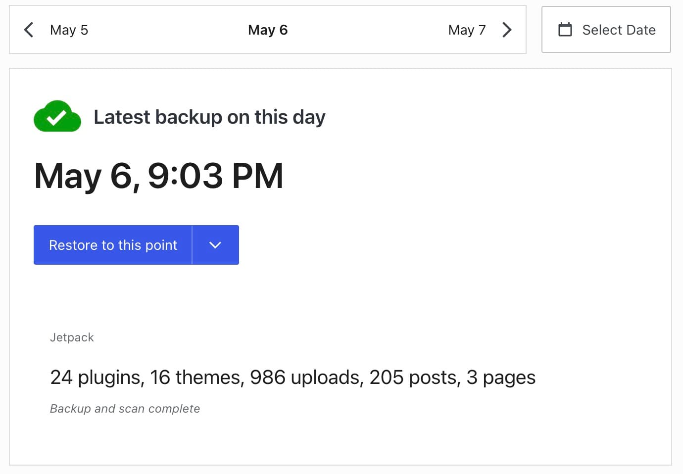 WordPress.com backup screen showing a completed automatic backup and a button labeled Restore to this point